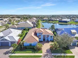 The Epitome of Lakefront Living in Naples Reserve