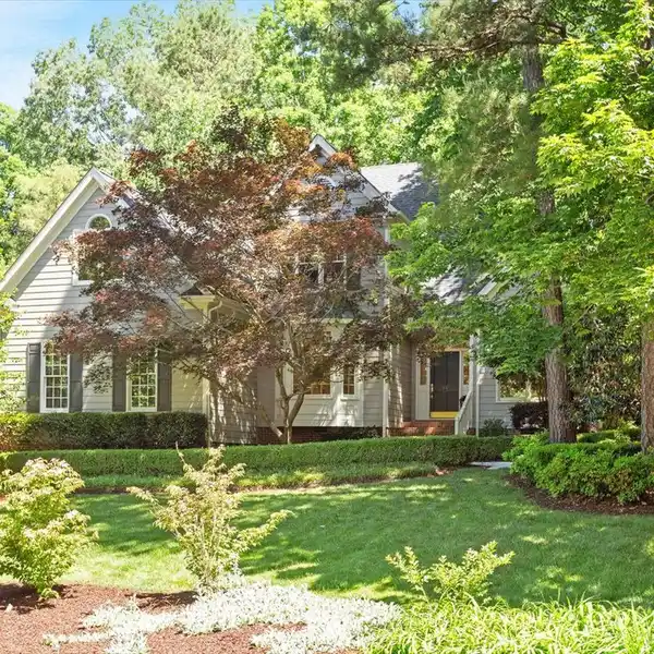 DISTINCTIVE HOME ON A LUSH LOT