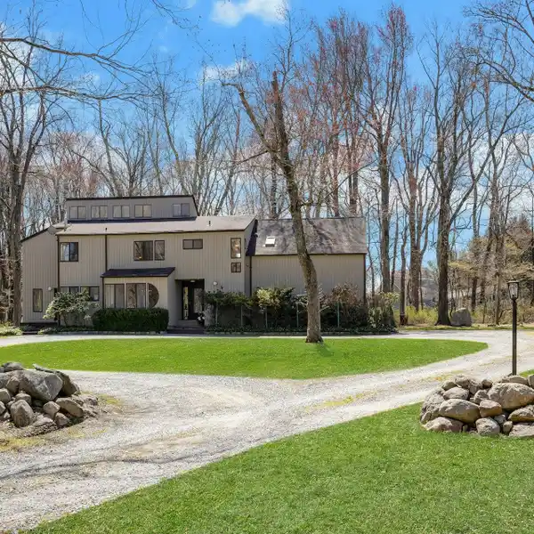 CONTEMPORARY COUNTRY COLONIAL ON OVER NINE ACRES